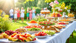 © Viks_jin - Upscale alfresco garden party featuring an abundant grazing table feast with fresh salads, fruits, and desserts. Guests celebrating during golden hour, luxury outdoor catering, summer event concept