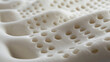 © Nishat - Close-up of the texture and structure inside a latex mattress to showcase its design, featuring multiple holes in each grid pattern for breathable airflow.