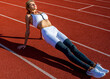 © Yevhen - Physical training education. Female runner stretching before workout