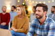 © Anzhela - Young Couple Engages in Meaningful Discussion at a Support Group Meeting Focused on Personal Growth and Shared Experiences