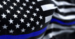© rarrarorro - The flag of the United States of America in the Thin Blue Line variant waving in the wind