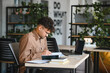 © Serhii - Focused arab student studying in modern university library