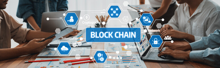 Fototapete - A professional team engages in a lively discussion about blockchain technology and its applications, surrounded by laptops and visual aids in a modern office environment. Amity