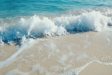 Wall Mural - Breaking waves on a white sand beach with clear blue water under bright sunlight, blue water sea waves breaking on white sand beach Photo background ing for live wallpaper