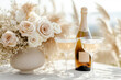 © Myroslava - Bottle of sparkling wine with a blank mockup label set on an outdoor table adorned with a bouquet of roses and pampas grass
