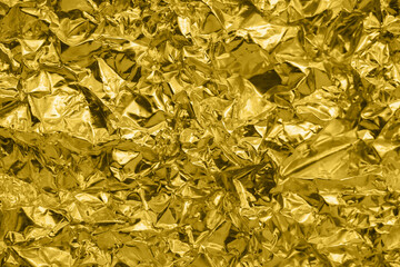 Wall Mural - luxury shiny metallic golden foil crumpled texture background