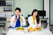 © laddawan - Doctors sharing fresh vegetables, promoting health and nutrition. Ideal for wellness, healthcare, and science themes.