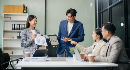Business teamwork and collaboration among Asian professionals in a modern office