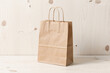 © Oktavianus - Kraft Bag Mockup over Light Wood Surface