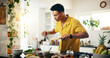 © EinFrame25/peopleimages.com - Banana, cooking and smoothie with man in kitchen of home for hobby, meal prep or nutrition. Fruit, ingredients or recipe and person in apartment with blender for diet or health as culinary chef