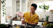 © peopleimages.com - Smoothie, health and man in kitchen in home for liquid diet with breakfast, nutrition or wellness. Beverage, detox and person with fruit drink for vitamins, snack or protein shake in apartment.