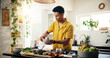 © peopleimages.com - Cooking, concentration and ingredients with man in kitchen of home for hobby, meal prep or nutrition. Passion, recipe and spices with person in apartment for diet, health or supper as culinary chef