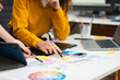© NINENII - Two caucasian designer meeting concept design ideas at office.