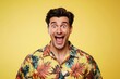 © Pavel - Smiling model man wearing tropical hawaiian shirt against bright yellow backdrop shows enthusiasm and joy in a relaxed atmosphere, perfect for summer vibes and beach adventures
