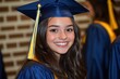 © Pavel - Brightly smiling graduate wearing cap and gown during graduation ceremony in school auditorium, celebrating a significant academic achievement with peers and family members
