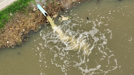 Drone captures water being channeled into farmland irrigation, illustrating the vital role of water in agriculture to maintain soil moisture and crop yields.

