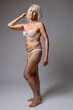 © danmorgan12 - Elderly Females Concepts. Winsome  Thoughtful Calm Positive Mature Confident Caucasian Woman in White Lingerie Posing Over White