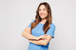 © ViDi Studio - Side profile view young fun Caucasian woman wears blue t-shirt casual clothes hold hands crossed folded look camera isolated on plain solid white color background studio portrait. Lifestyle concept.