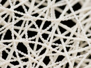 Close-up of White Thread Interwoven in a Complex Pattern