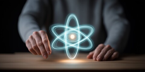Wall Mural - quantum physics computing concept. holographic atom model with hands manipulating it.