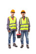 © Pituk - Two young Asian male engineers in orange vests and helmets holding tools and equipment standing isolated on white background.