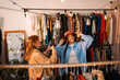 © Big Shot Theory - Fashionable Friends Enjoying a Stylish Photoshoot in a Vintage Clothing Store