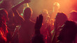 © master1305 - Vibrant party scene with diverse individuals dancing in a dimly lit, smoke-filled club with vibrant red and orange lighting. Concept of party, youth, nightclub, celebration