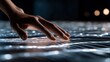 © Daxxt - Close-up of a hand hovering over a glowing, interactive surface