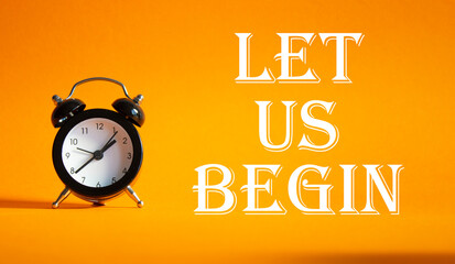 Wall Mural - let us begin symbol. concept word let us begin on beautiful orange background with alarm clock. busi