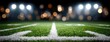 © lililia - Bright stadium lights shine down on an American football field marked with white lines during a nighttime event
