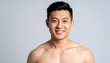 © hardvicore - Portrait of handsome shirtless man with muscular torso. Young Asian guy with stylish hair. Sport
