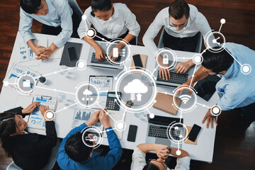 Poster - A dynamic group of professionals collaborates on a computing project, utilizing cloud technology and data visualizations in a modern office setting, enhancing productivity. Amity
