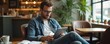 © miss irine - Handsome hipster man uses digital tablet in cafe. Male works, studies with device. Bearded adult in glasses, freelance worker, modern businessman. Technology, communication, online business concept.