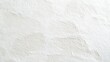 © Laman - Photograph of textured, off-white concrete wall with subtle irregularities and surface marks.