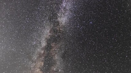 Wall Mural - beautiful night sky time lapse with bright milky way galaxy on dark sky. starry night background.
