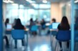 © abdul - Blurry indoor scene of people working in a modern study area