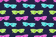 © Va1kyrja - Bright seamless pattern with colorful cat-eye sunglasses on dark background. Fun and trendy design perfect for summer products, textiles, and packaging.