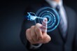 © StockHive - Businessman touching digital target hologram.