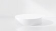 © Rafi - Hexagon-shaped white podium under angled natural light casting soft hexagonal shadows on white surface