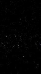 Poster - abstract loop rainfall raindrops with bouncing effect loop vertical animation on black background.
