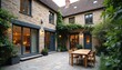© Pete - Exterior view stylishly renovated Mews house in UK. Modern farmhouse style interiors. Stone walls, big glass door windows. Traditional architecture, luxury real estate. City life residence, european