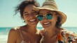 © Oleksandr - Smiling At The Beach. Mother and Adult Daughter Embracing by the Ocean on Summer Getaway