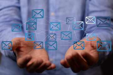 Aufkleber - Image of a man's hands holding a network of email icons, representing global communication and connectivity.