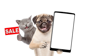 Aufkleber - Funny Pug puppy holds big smartphone with white blank screen in it paw, showing close to camera. Happy cat showing signboard with labeled 