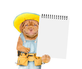 Poster - Smiling Mastiff puppy wearing summer hat and denim overalls with tool belt shows empty list. Isolated on white background