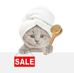Fototapete - Cute kitten with towel on it head holds shower brush and shows signboard with labeled 