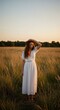 © RickR - Photo of a Woman in a Golden Field Smiling and Wearing White Dress