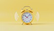 © K silver - Morning alarm clock ringing alarmingly home office image bright yellow background close-up view time management concept