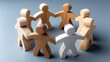 © lililia - Wooden figurines join hands forming a circle, symbolizing teamwork and support in a business office environment, promoting collaboration