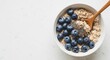 © IbragimovN - Healthy breakfast bowl with blueberries and chia seeds for men's health month